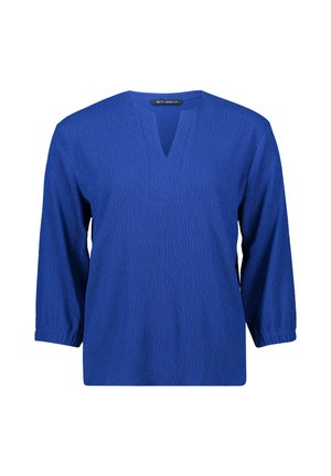 Blusa blu con texture, scollatura a V, maniche a tre quarti e vestibilità comoda. Presenta sottili righe verticali per un tocco di dettaglio.