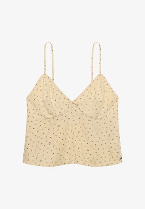 Top tipo camisola beige claro con tirantes finos ajustables, pequeño estampado floral azul, copas fruncidas y un pequeño lazo decorativo en el centro delantero.