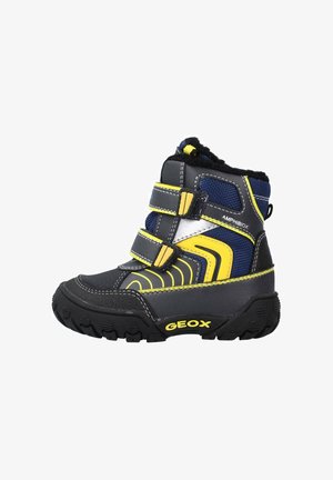 Kinder-Winterstiefel in Schwarz, Marineblau und Gelb mit zwei Klettverschlüssen, einer dick profilierten Sohle und Fleecefutter, beschriftet mit "Amphibiox" und "Geox".