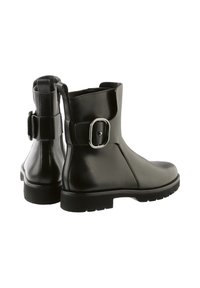 Black leather ankle boots featuring a rounded toe, a side buckle accent, and a textured rubber sole for enhanced grip.