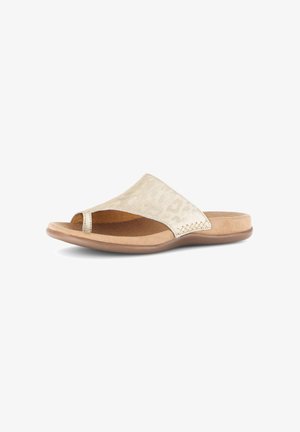 Beige open-toe slidesandaal met een brede, getextureerde band en een gevoerde zool, weergegeven op een witte achtergrond.