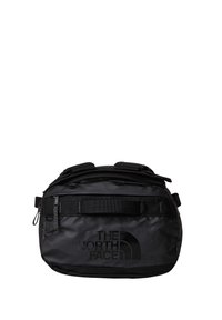 Svart gymväska med en glansig finish, utrustad med dragkedjefack, justerbara remmar och en framträdande logotyp på sidan.