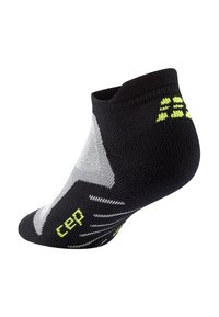 Calzino nero alla caviglia con accenti grigi e verde lime. Presenta un filo lavorato a maglia testurizzato, punta rinforzata e aree in rete per la traspirabilità.