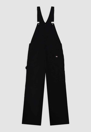 Mustat haalarit, jotka on valmistettu kestävästä kankaasta, leveillä lahkeilla, säädettävillä olkaimilla, sivutaskuilla ja pienellä logolla edessä.