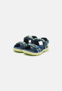 Navy blue sandals with adjustable patterned straps in yellow and green. Features cushioned sole and open toe design for breathability.