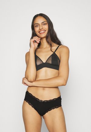 Black lingerie set featuring a sheer triangle bralette with adjustable straps and matching boyshorts with lace trim and bow detail.