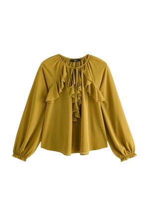 Senfgelbe Bluse mit langen Ärmeln, gerafftem Vorderteil, Rundhalsausschnitt und elastischen Bündchen. Leichter Stoff mit fließendem Schnitt.