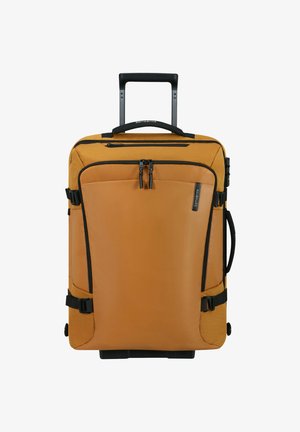 Orange soft-sided rolling suitcase with telescopic handle, front zipper pocket, side handle, and compression straps.
