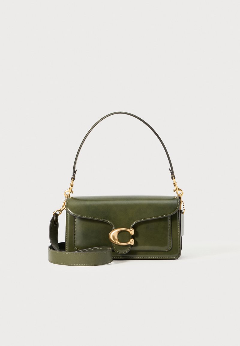 Green leather handbag with a structured shape. Features a gold hardware clasp, a detachable shoulder strap, and stitching accents.