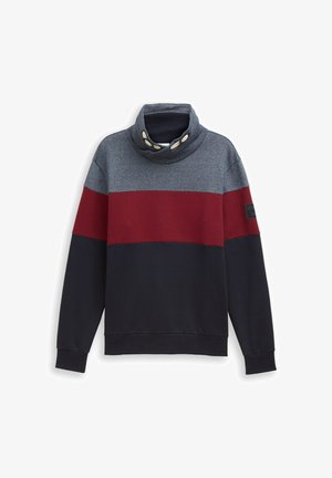 Kagylónyakú pulóver szürke, bordó és tengerészkék csíkos mintával. Puha anyagból készült, kontrasztos gombokkal és logóval ellátott folttal.