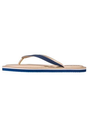 Flip-Flop mit beigem Fußbett, blauen Gummiriemen und strukturierten Akzenten. Flache Sohle mit blauer Kante und subtilem Profil.