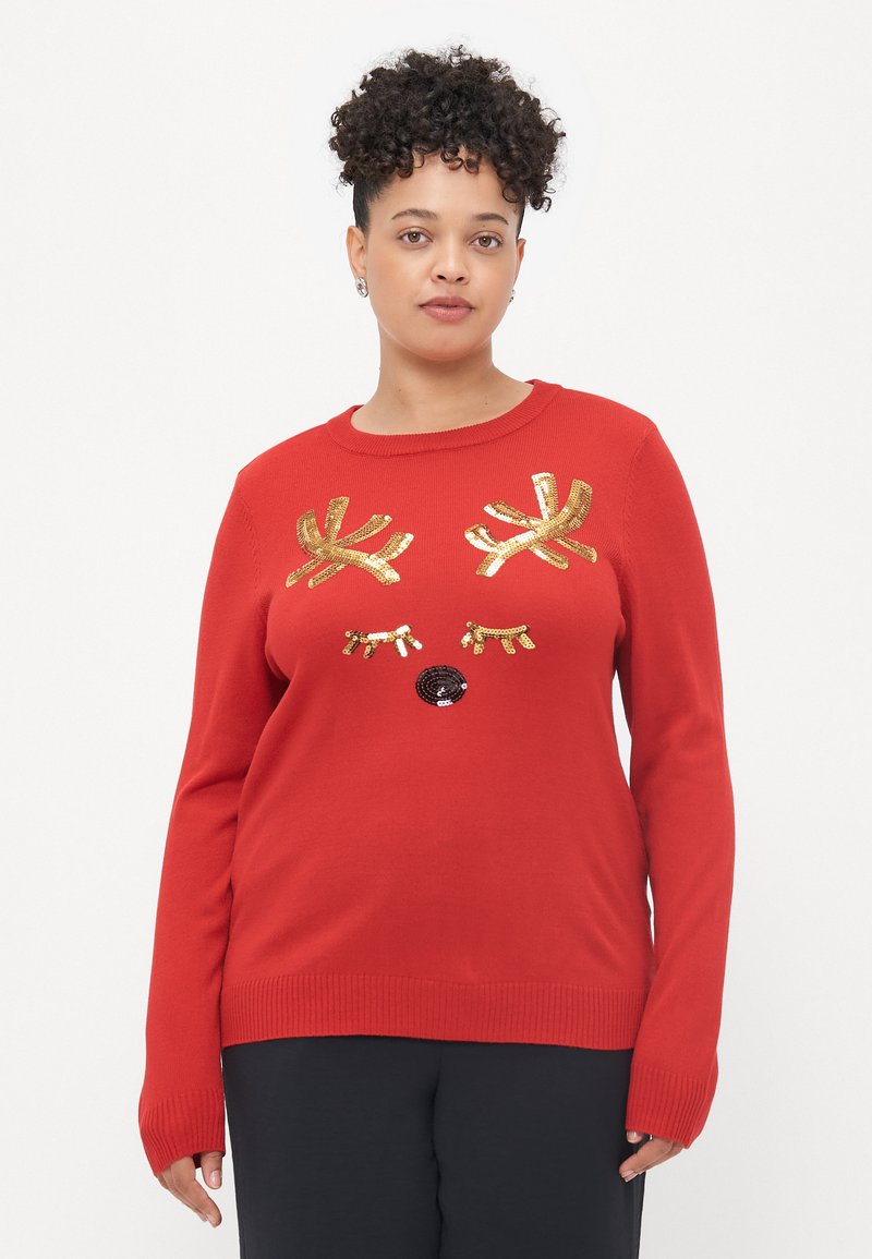 Sweater vermelho com chifres de rena em lantejoulas douradas e um nariz em lantejoulas pretas. Mangas longas, punhos e bainha canelados. Textura suave.