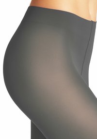 Durchsichtige, hochtaillierte Leggings in Dunkelgrau mit einer glatten, gerippten Textur. Sie bieten eine enganliegende Passform und subtile Nähte für ein stromlinienförmiges Erscheinungsbild.