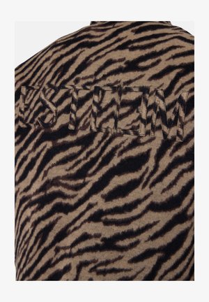 Brown fabric featuring a black tiger stripe pattern with embroidered text "ESTEEM" in a raised style, adding texture and visual interest.