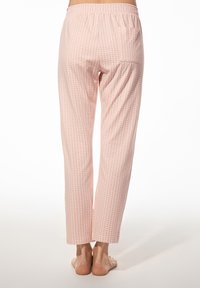 Lichte roze pyjamabroek met een subtiel bladerenpatroon, elastische tailleband en rechte pasvorm; zachte textuur en enkellang.