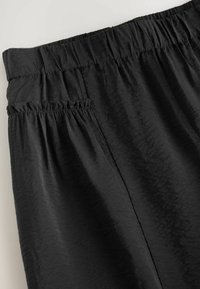 HAREEM - Trousers - black