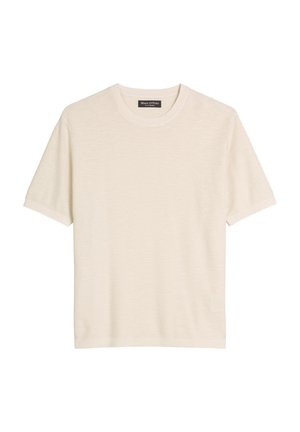 Kremowy t-shirt z krótkim rękawem i okrągłym dekoltem, z metką Marc O'Polo wewnątrz kołnierza, prezentowany na płasko na białym tle.