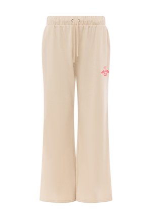 Beige weite Sweatpants mit elastischem Bund und Kordelzug, mit kleinem pinkfarbenem "Feel Good Club" Schriftzug am oberen Oberschenkel.