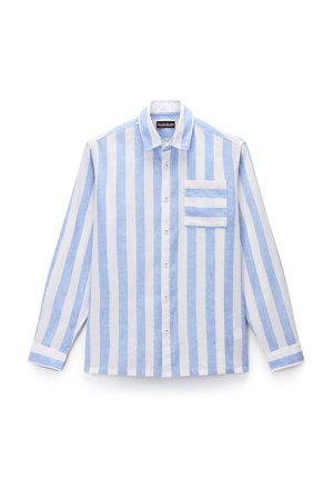 Chemise à manches longues rayée bleu et blanche avec un col boutonné, une poche avant et un tissu contrastant au niveau des poignets. Fabriquée en lin.