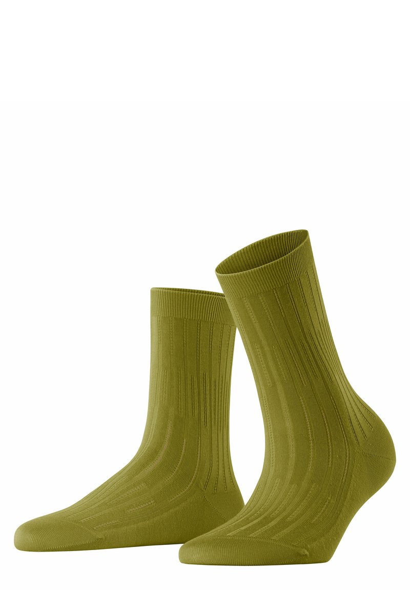 Grüne Knöchelsocken mit vertikaler Rippenstruktur, nahtlosem Zehenbereich und verstärktem Fersenbereich. Sie zeichnen sich durch ein klassisches Design aus und bestehen aus einem weichen, dehnbaren Material.