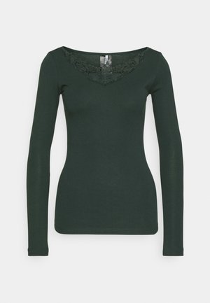 Dark green long-sleeve shirt with a wide neckline and lace detailing at the chest. Made from smooth, stretchy fabric. Fitted design.