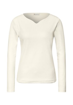 Top s dlouhým rukávem z žebrované látky v krémové barvě, s výstřihem do V a hladkým povrchem. Jednoduchý, přiléhavý střih bez dalších zdobení.