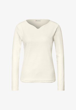 Top de manga larga en tejido acanalado color blanco roto, con escote en V y textura suave. Diseño sencillo y ajustado, sin detalles adicionales.