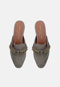Textured, gray and black woven slip-on shoes with a chain accent and decorative hardware, featuring an almond toe and open back.