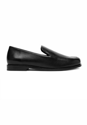 Black leather slip-on loafer with low heel and rounded toe, shown in profile against a white background.