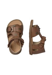 Hnědé sandály se dvěma nastavitelnými popruhy, zdobené vzory listů. Vyrobené z umělého materiálu s flexibilní gumovou podrážkou.