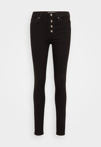 Jeans skinny de mezclilla negra con cintura alta, cinco bolsillos y una cremallera frontal con cinco botones metálicos. Textura suave.