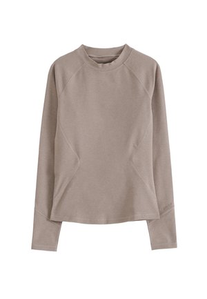 Lyse taupe langermet genser med rund hals, raglanermer og buede sømmer. Laget av et mykt, teksturert stoff.