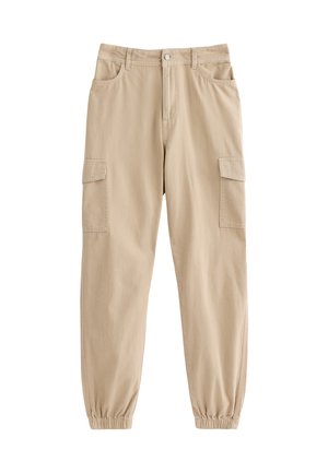 Pantalons cargo beiges en coton, dotés de poches latérales, d'une jambe fuselée avec des poignets élastiques et d'une fermeture à bouton à l'avant.