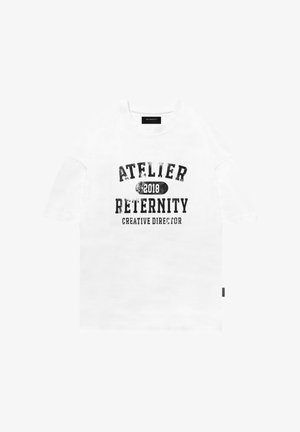 White cotton t-shirt with short sleeves, featuring black distressed text: "ATELIER 2018 RETERNITY CREATIVE DIRECTOR." Simple, relaxed fit.