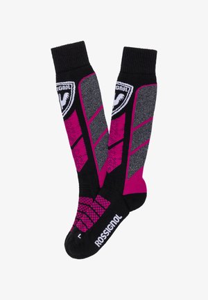 Calze Rossignol a ginocchio in nero, grigio e magenta con toppe con logo e motivi geometrici, progettate per gli sport invernali.