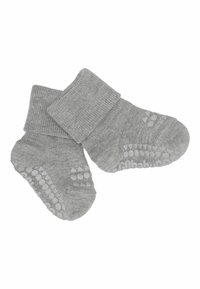 Paire de chaussettes grises pliées pour bébé avec des points en silicone antidérapants sous la semelle, conçues pour la sécurité et le confort des nourrissons.