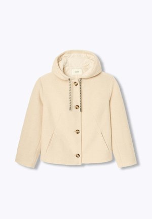 Veste en laine beige à capuche avec boutons sur le devant, cordon de serrage à la capuche et poches latérales en biais, présentée sur un fond blanc.