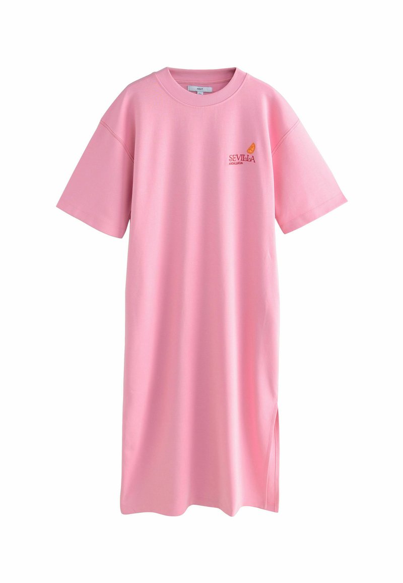 Rózsaszín, túlméretezett T-shirt ruha puha anyagból, környakú, rövid ujjú, narancssárga "Sevilla" logóval a mellrészen.