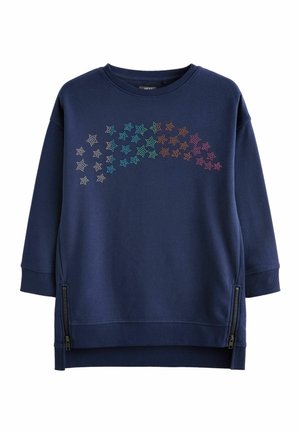 Sweatshirt bleu marine à col rond, avec des motifs d'étoiles multicolores en strass à l'avant. Comprend des détails zippés sur les côtés.
