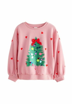 Różowa bluza z czerwonymi sercami, z zieloną choinką ozdobioną kolorowymi pomponami i cekinami, zwieńczona czerwoną kokardą.