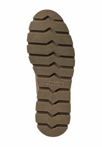 Semelle de chaussure marron avec des rainures horizontales profondes et en chevron, portant le nom de la marque Tamaris et le numéro de taille 37 embossés.
