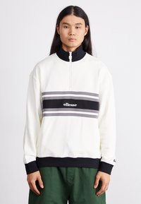 Witte zip-up sweatshirt met een zwart en grijs gestreepte band over de borst, met het "ellesse" logo. Zachte stof en geribbelde manchetten.