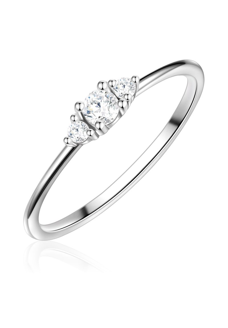 Three-stone ring crafted from polished silver, featuring three round, brilliant-cut clear stones with prong settings and a smooth band.