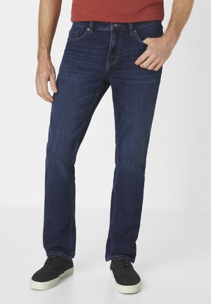 Dark blue denim jeans with a straight-leg fit, five pockets, and a subtle faded texture. Worn with black sneakers.