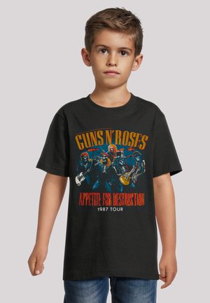 Black cotton t-shirt featuring a graphic print of a rock band, with red and yellow text reading "GUNS N' ROSES APPETITE FOR DESTRUCTION 1987 TOUR."