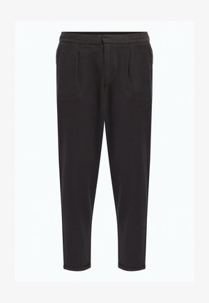 Mustad, kitsendatud püksid pehmest kangast, elastse vöökoha, esiplehvide ja mansettidega hemmedega, luues peene ilme.