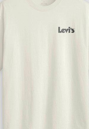 Cream-colored Levi's t-shirt with small black Levi's logo printed on the upper left chest, loose fit and crew neckline.