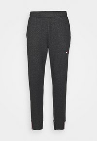 Graue Jogginghosen aus Heather mit elastischem Bund, Seitentaschen und gestreiften Akzenten an den Säumen. Sanfte Textur und taillierter Schnitt.