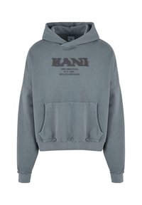 Oversized grey hoodie made of soft fabric, featuring a front pocket and text logo. Design includes ribbed cuffs and frayed hem details.
