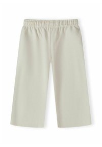 Pantalon beige clair à jambes larges avec taille élastique, longueur cheville, en tissu doux pour un port décontracté.